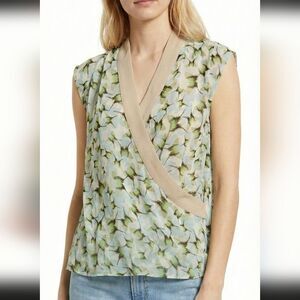CAbi Butterfly faux-wrap semi-sheer sleeveless blouse in a green white floral M